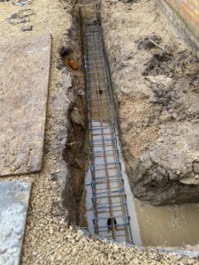 Steel supports and cement in the ground