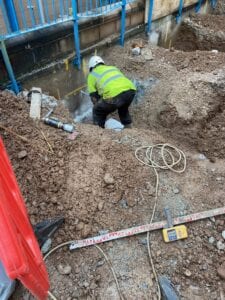 Man marking up for piling supports