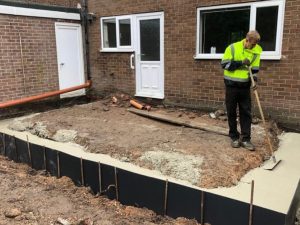 Construction Worker testing soil